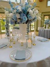 The Alice wedding white and blue floral collection table centrepiece