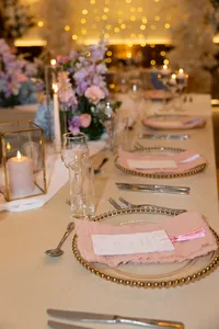 pastel floral table centrepieces and pink place settings