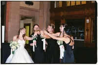 Chicago wedding photo of a bride cheering with her 4 bridesmaids on her wedding day.