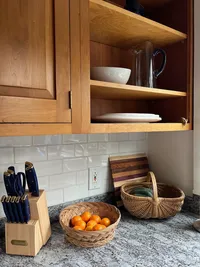 Kitchen cabinetry, open shelving and countertop at Brookside Retreat