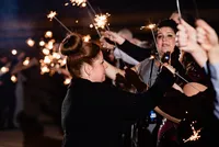 Wedding Planner with Weddings & Events by Raina lights sparklers for send off