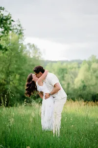 Engaged couple kissing each other during an engagement photography session in Prince Edward County.