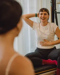 welcoming-pilates-studio-smiling-client-plum-pilates-london