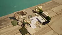 Wedding videography still of shoes and formal details positioned by poolside
