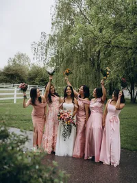 Chicago wedding photographer Grace Wan captures a bride smiling with her 5 bridesmaids standing next to her all smiling and looking at each other.
