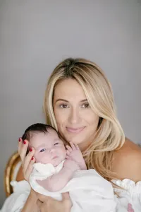 Close-up of mother holding her newborn during a studio portrait session