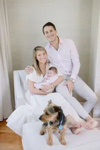Family portrait with newborn baby and their dog