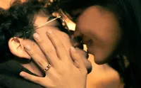 Close up of a couple about to kiss, cropped so you can just see their faces.