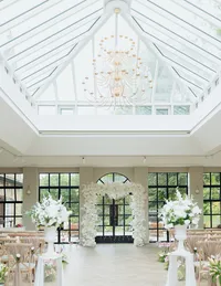 white square wedding ceremony arch inside Yorkshire wedding venue