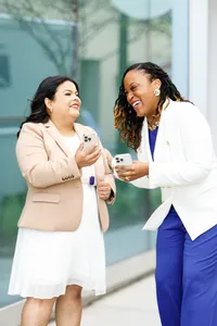 Founders of a minority and women-owned marketing firm laughing