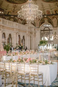 Candlelit reception table set beneath a hand painted domed ceiling at The Breakers Palm Beach