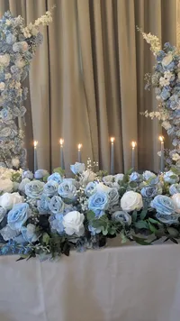 The Alice wedding white and blue floral collection table decor with candles