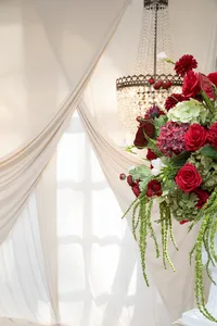 red and burgundy wedding floral arrangement