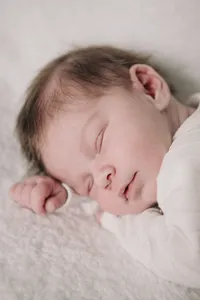 Close-up of a sleeping newborn during a studio portrait session
