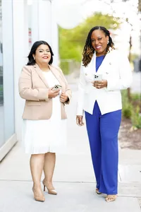 Founders of a minority and women-owned marketing firm smiling