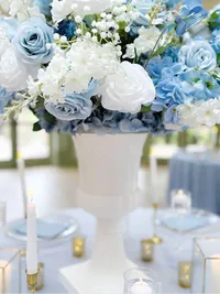 The Alice wedding white and blue floral collection table centrepiece