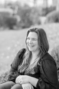 Woman's branding portrait laughing, photographed in black and white