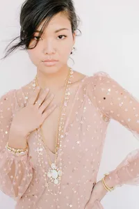 Woman's branding portrait in a pink sequined top