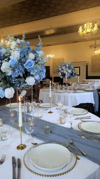 The Alice blue and white wedding table centrepieces