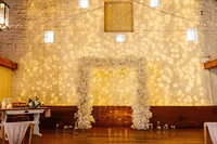 white square wedding floral arch with fairy light backdrop