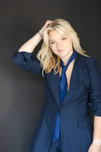 Girl's branding portrait in a navy suit