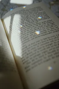 light and shadows across open book pages