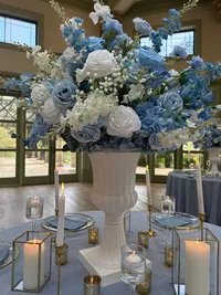 The Alice wedding white and blue floral collection table centrepiece
