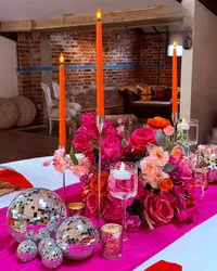 Deighton Lodge wedding styling, bright pink table decor and colourful table centrepiece with candles and disco balls