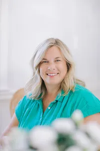 Woman's branding portrait in a teal top