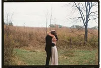 A bride and groom hug during their first look, by Michigan wedding photographer Grace Wan.