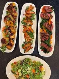 Platters of beautiful farm to table dishes catered by The Country Eatery