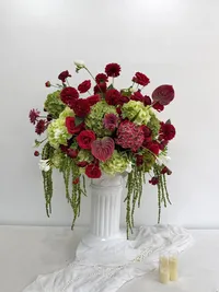 The Odette red and burgundy wedding floral display