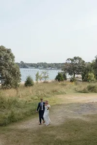 A bride and groom take their wedding portraits on the Chesapeake Bay shoreline