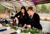 Weddings planners with Weddings & Events by Raina lighting candles before the wedding reception