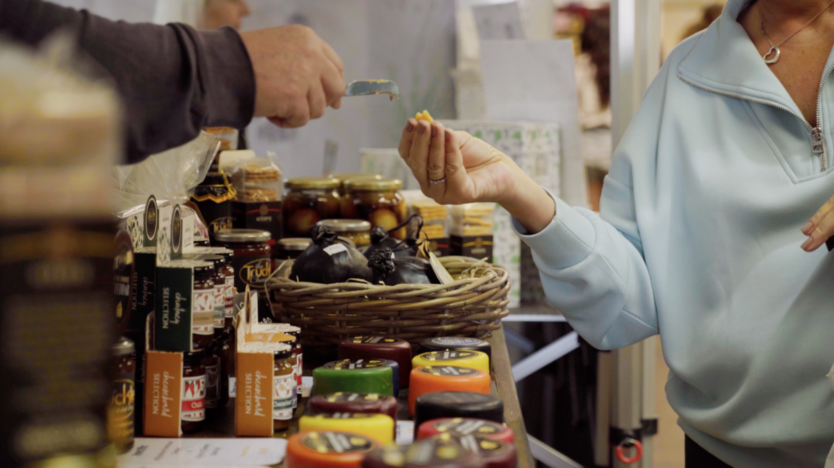 Tasting cheese at a food stall