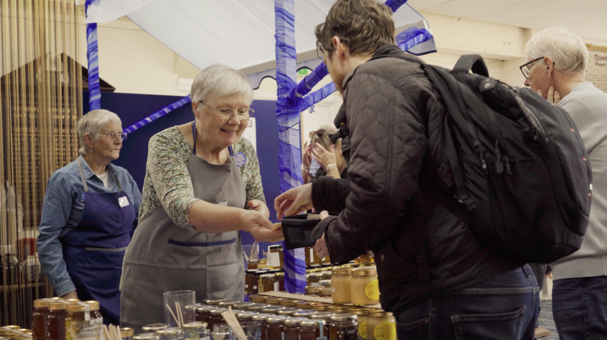 Buying honey at a county show stall