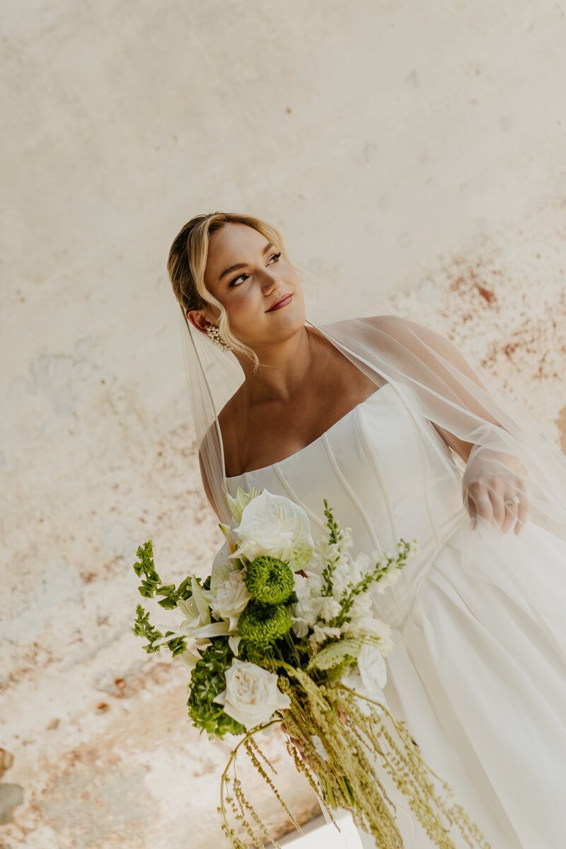 Bride with green and white bouquet