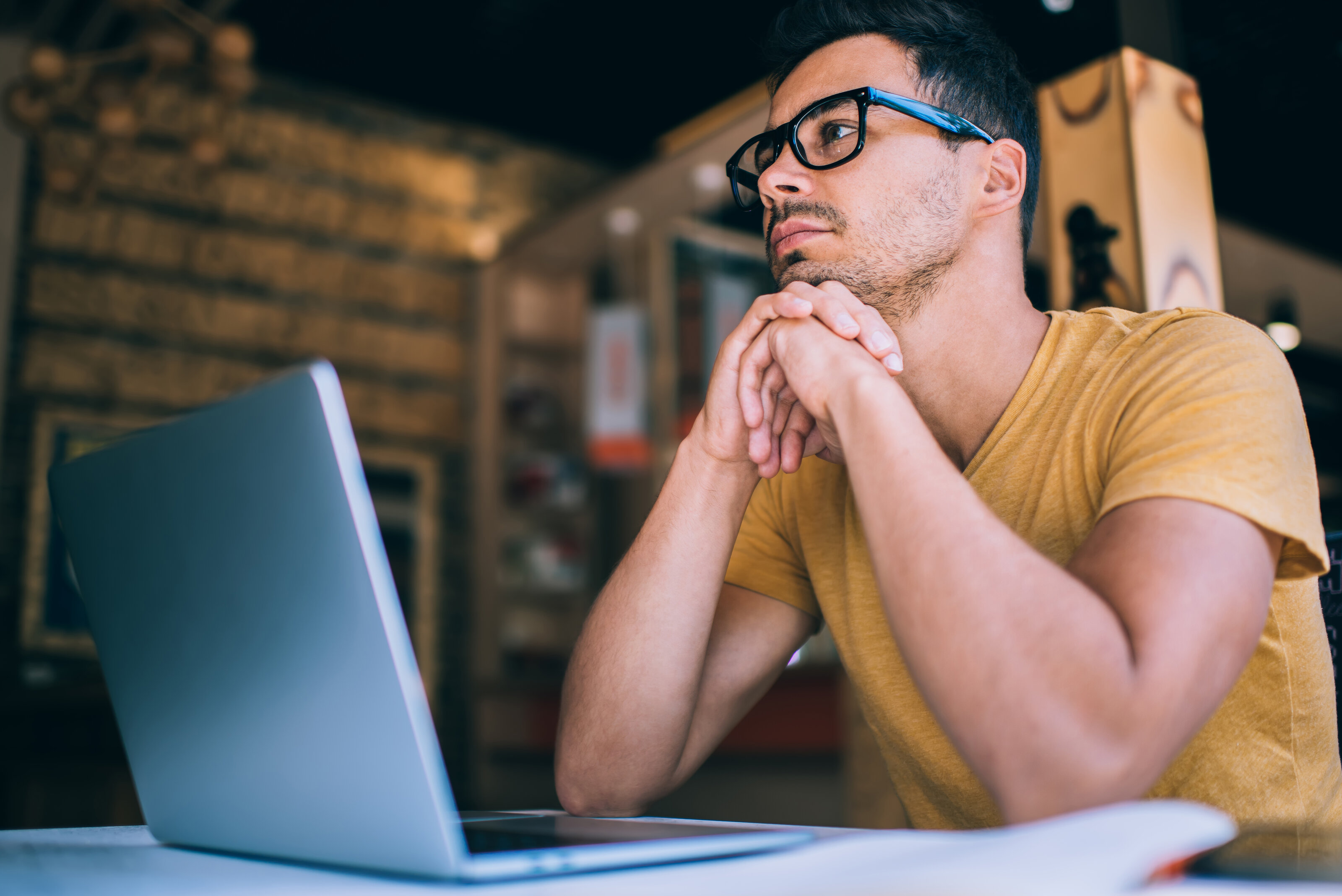 A man at his desk, lost in thought