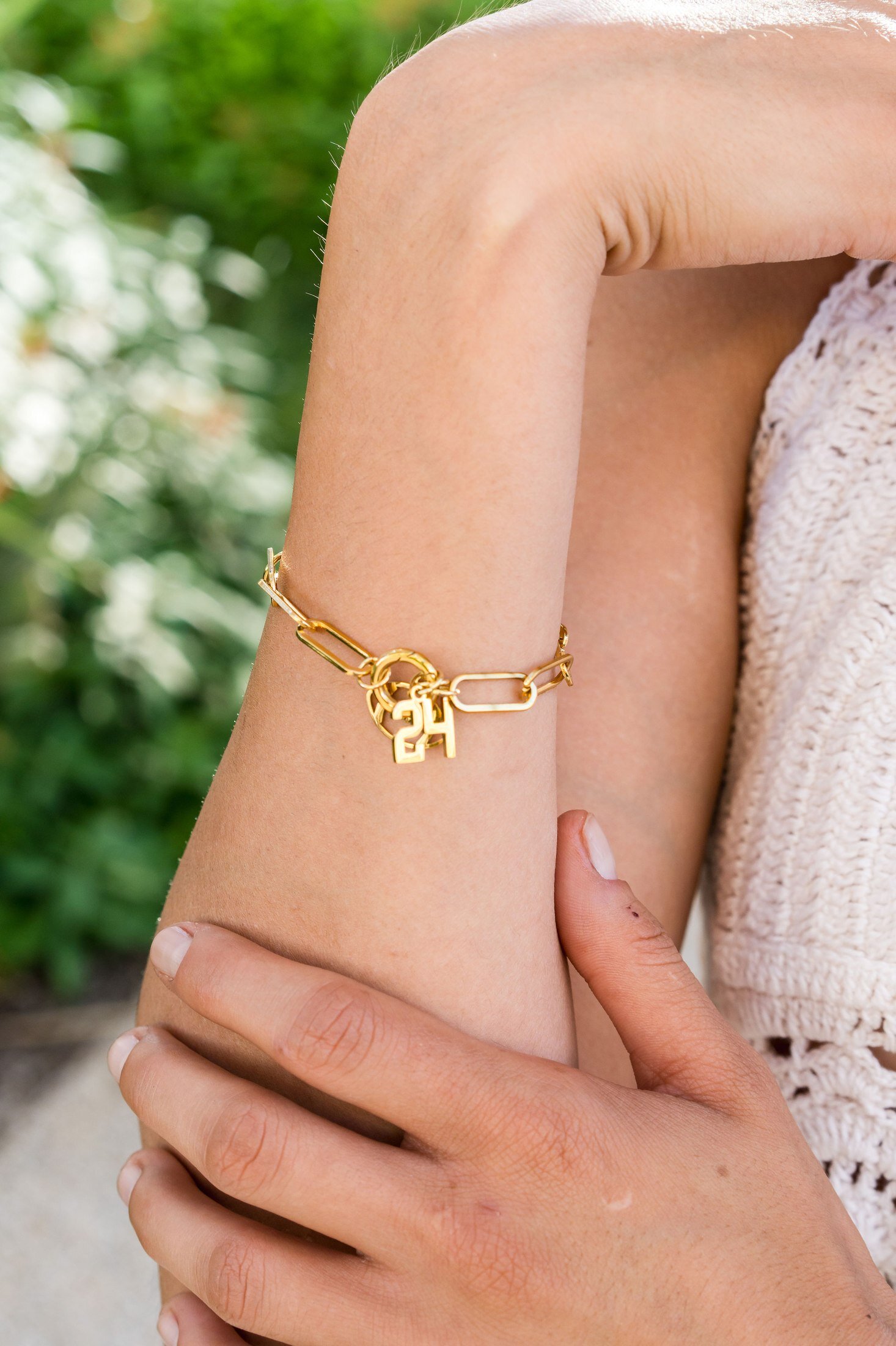 Close-up of Charm Theory model wearing charm necklace