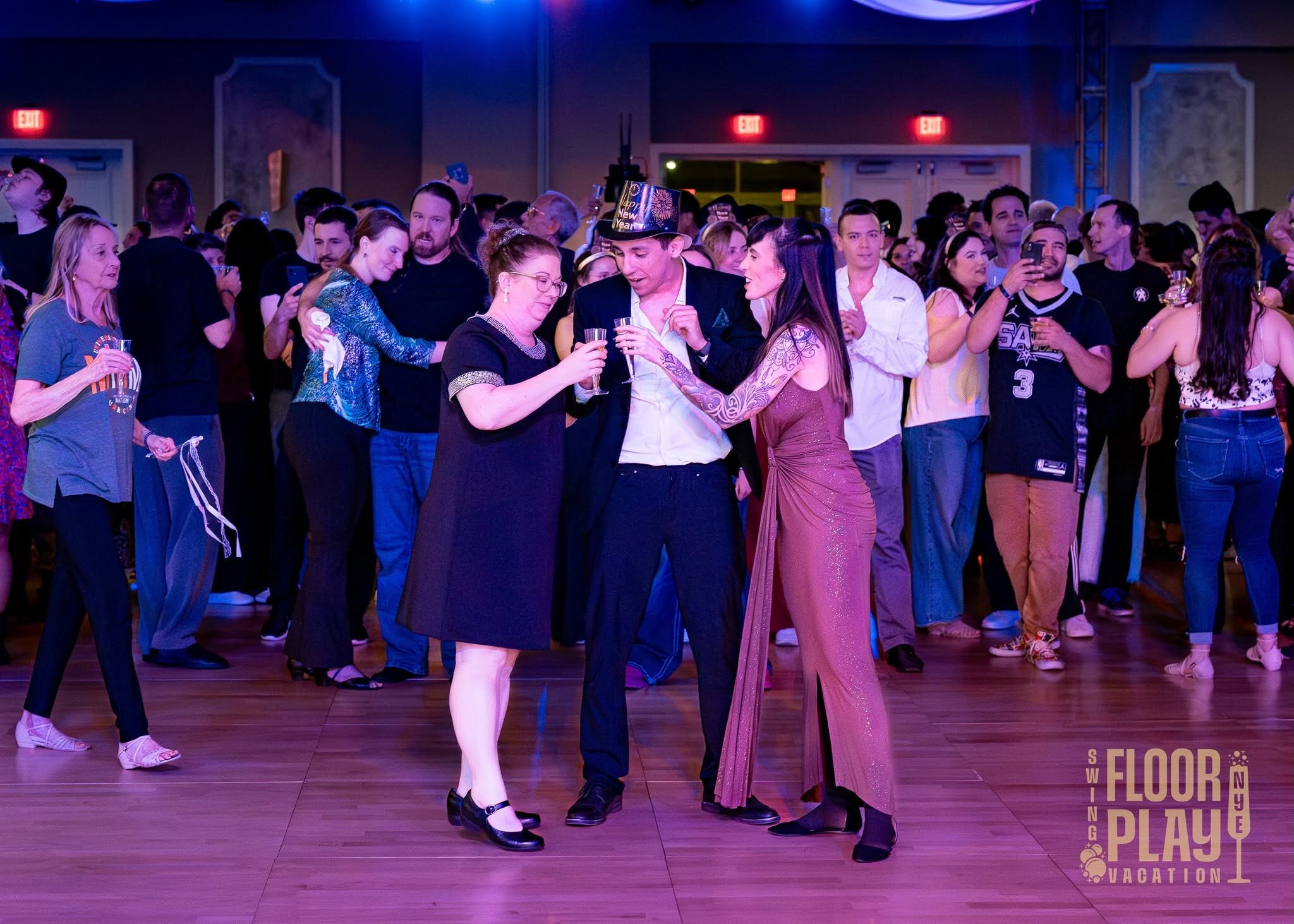 Guests raising glasses for a toast at a past Floorplay New Year’s Eve celebration