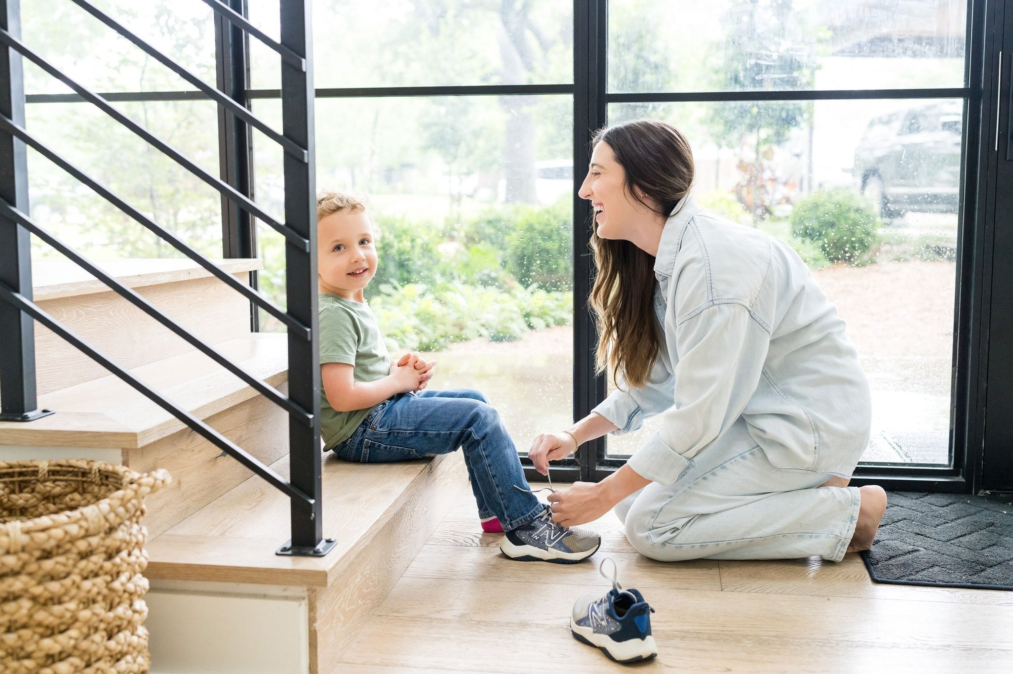 Nanny helping a toddler with shoes at a bright entryway, Austin