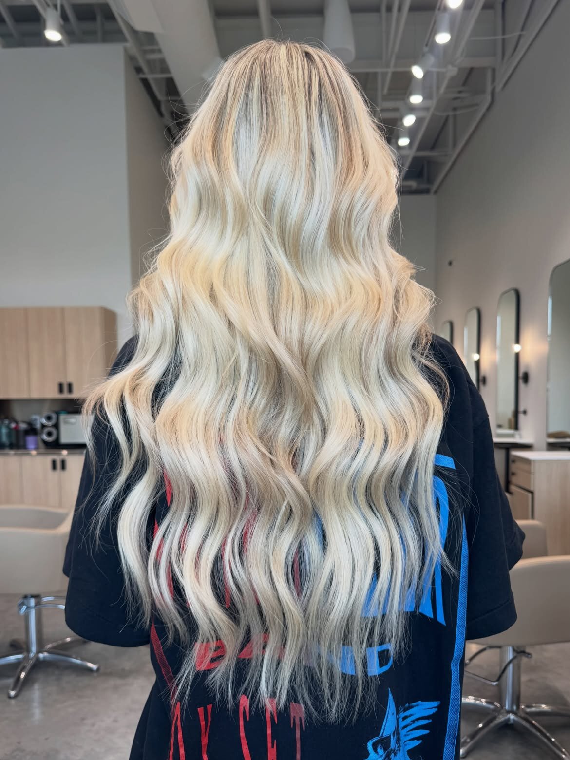 Custom blonde hair color and hand-tied extensions at Echelon Salon in Eagle, Idaho