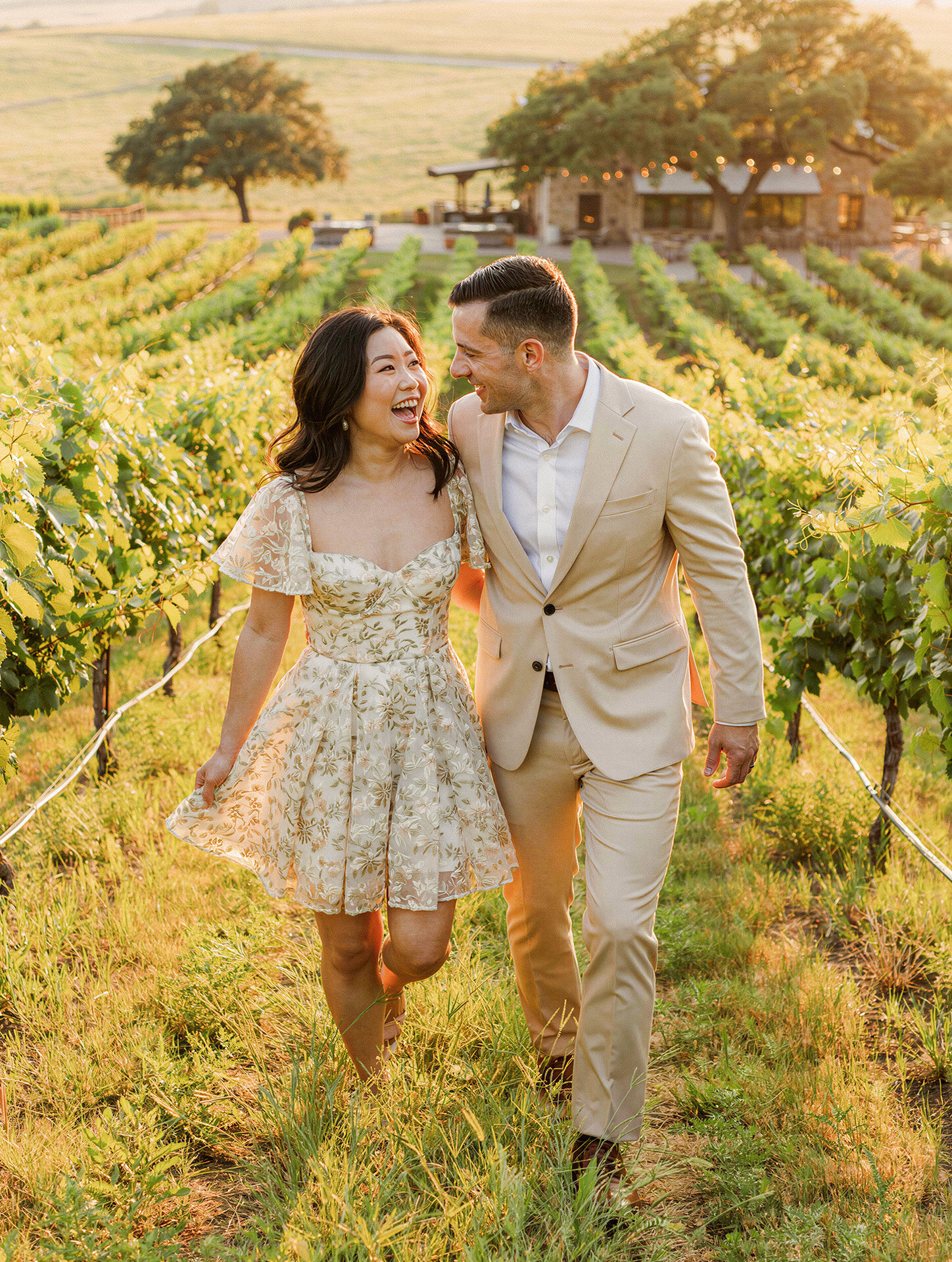 Laughing bride and groom at a Texas Hill Country vineyard wedding
