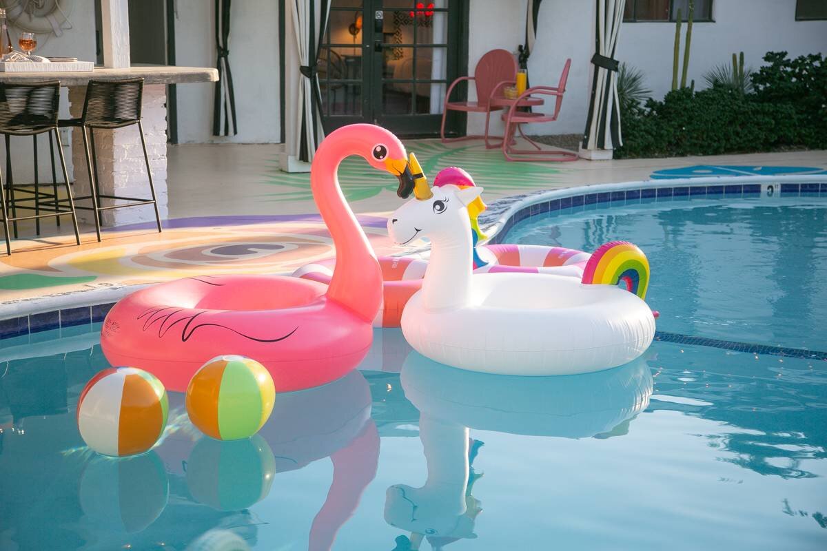 Flamingo and unicorn floats in the pool