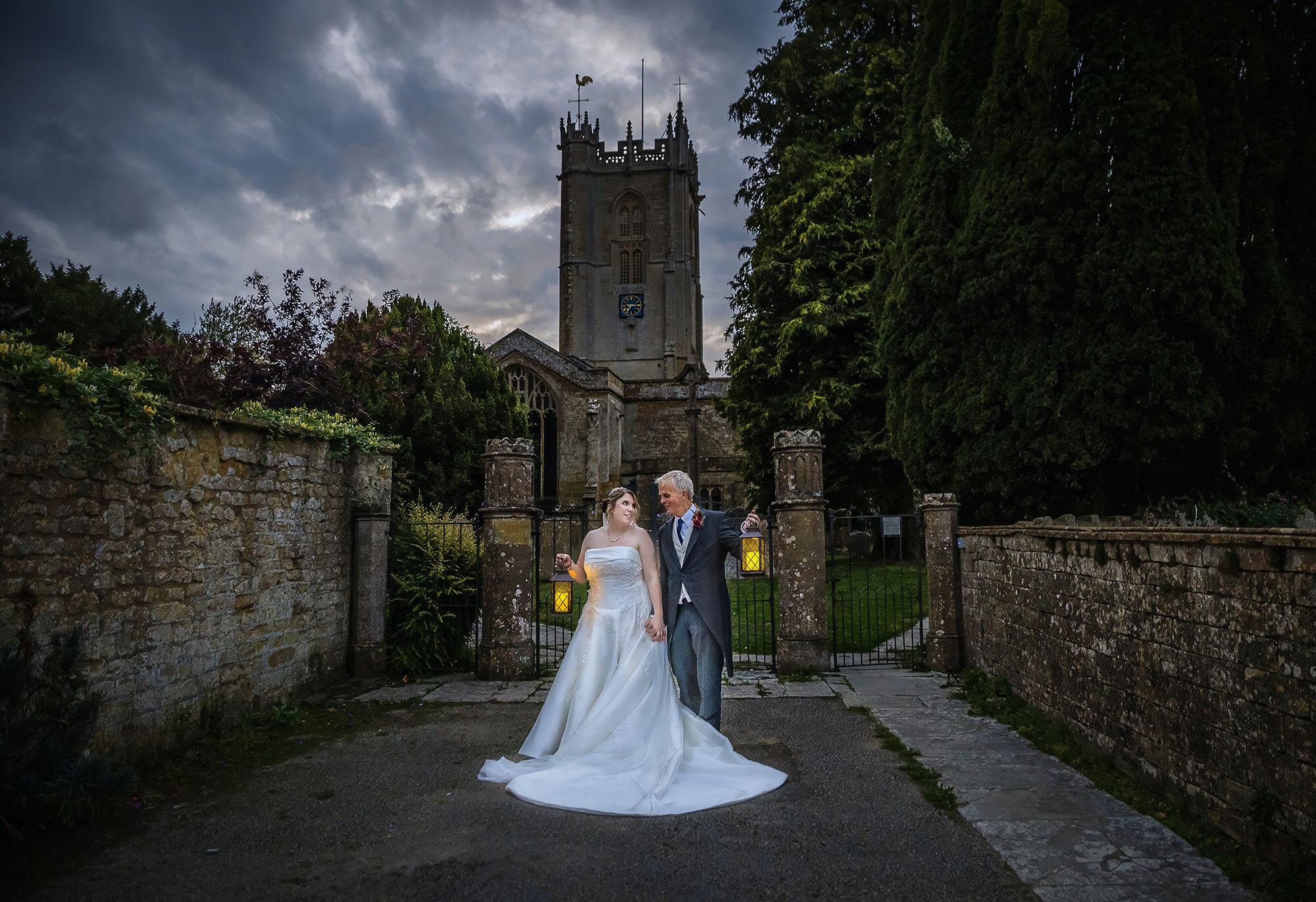 Bride and groom outside historic stone church