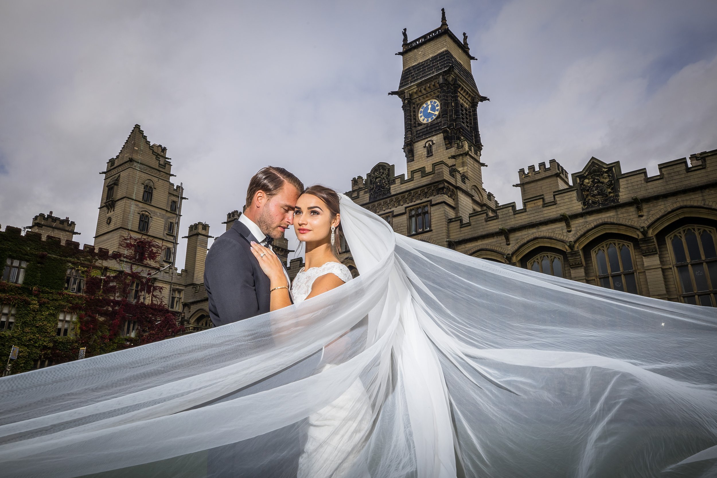 Bride and groom with flowing veil