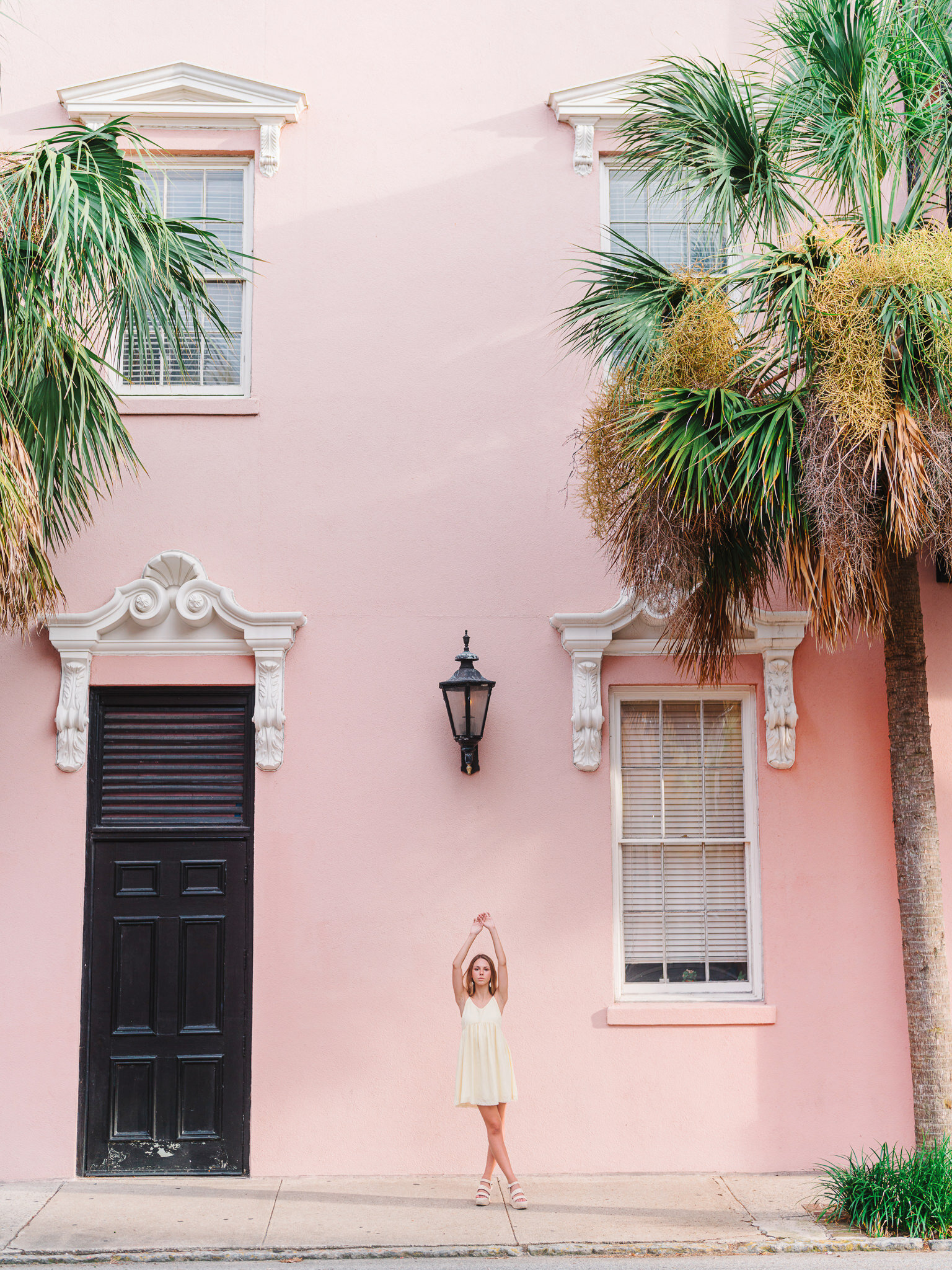 Golden hour senior portrait session in Charleston with professional directing