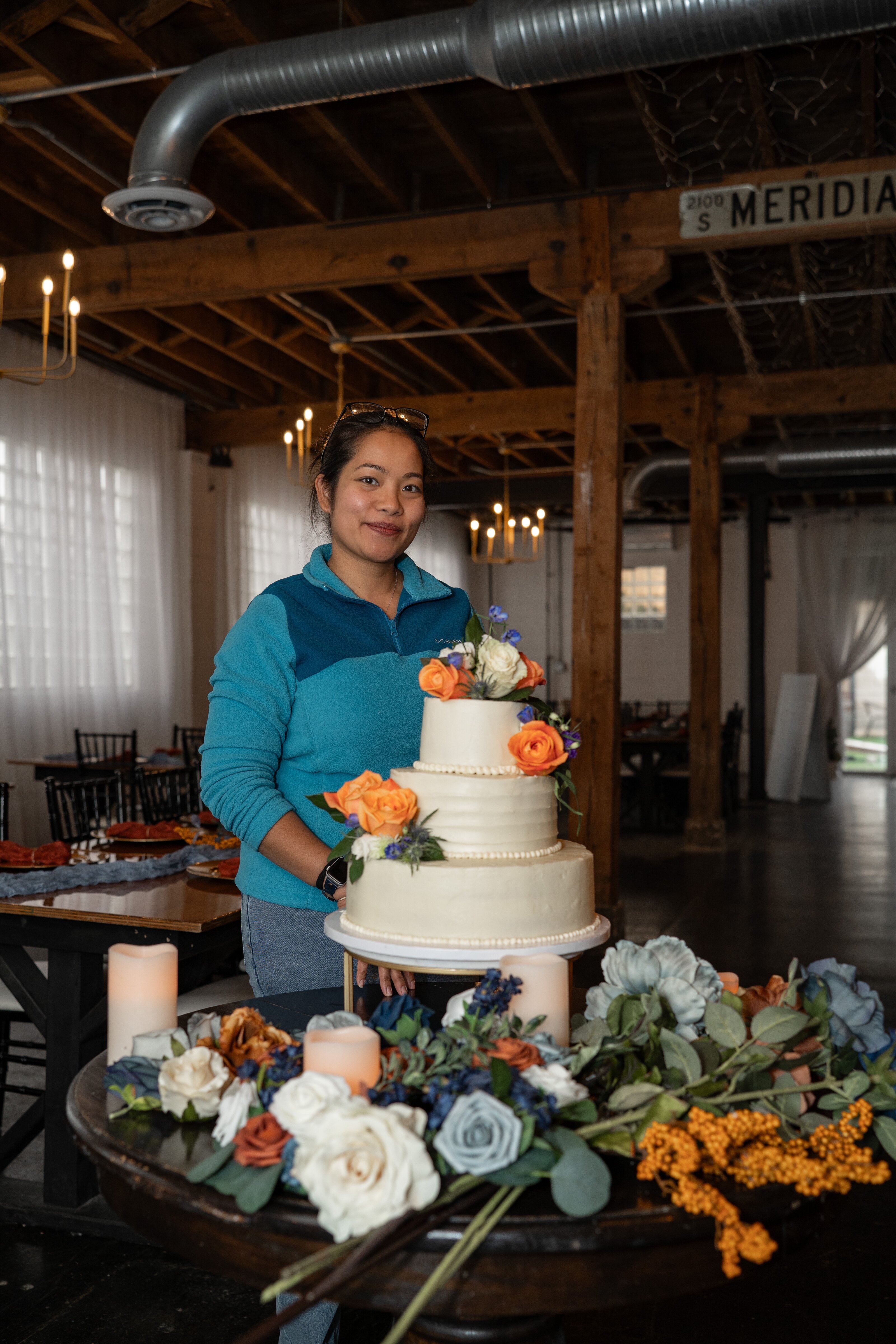 Small business owner with her wedding cake