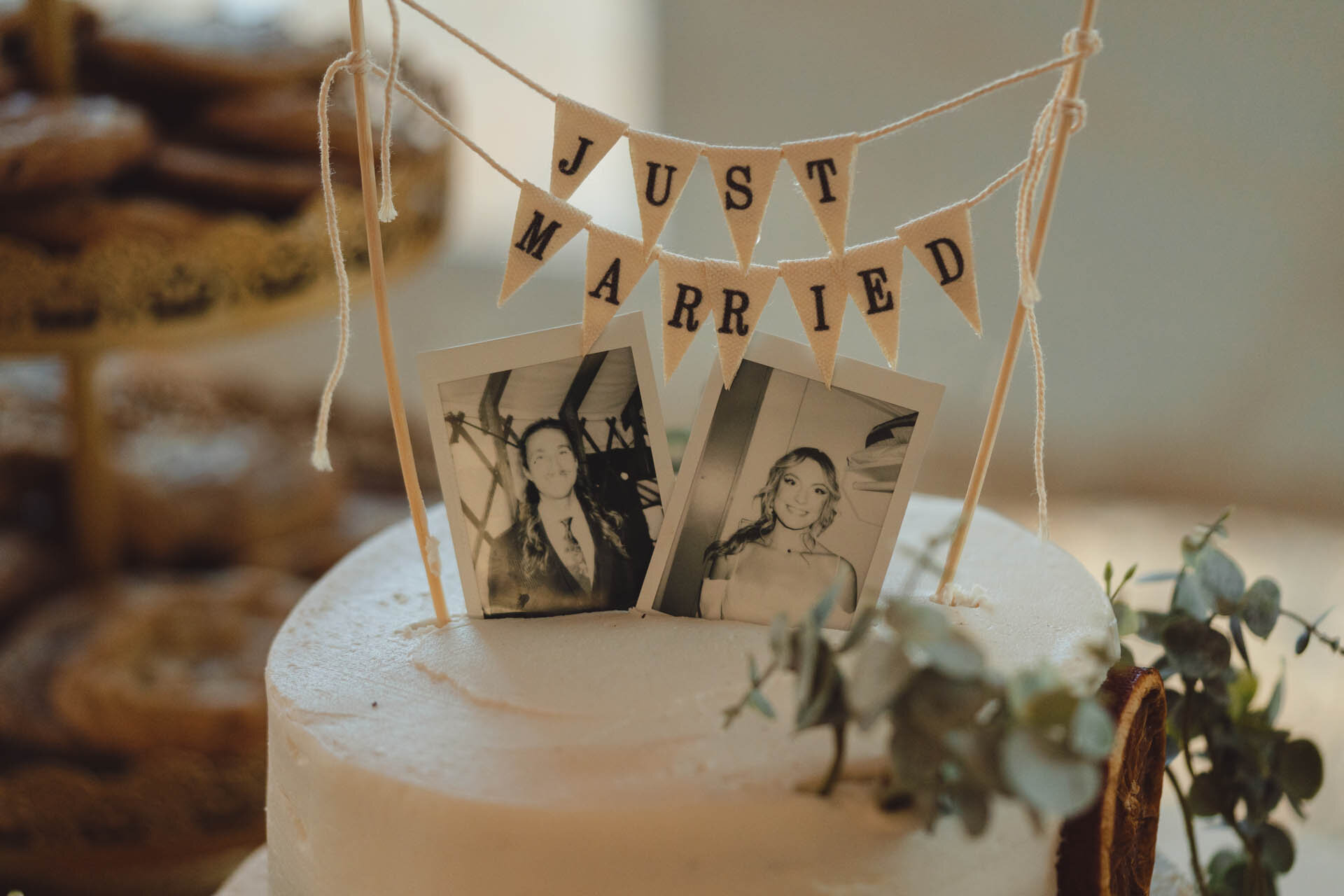 Winter wedding cake in Flagstaff with black and white portrait of the bride and the groom