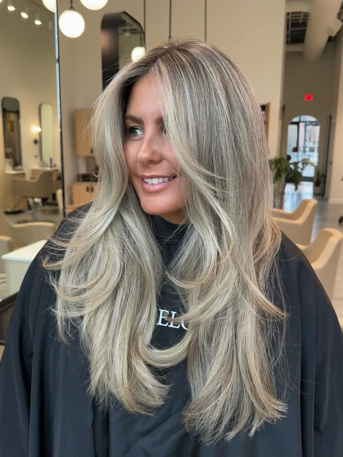 Blonde hair color, hand-tied extensions and blowout created at Echelon Salon in Eagle, Idaho
